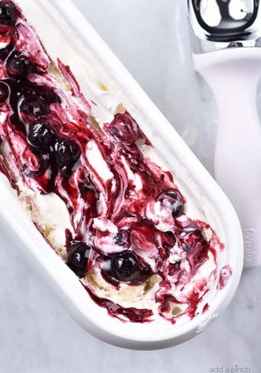 Blueberry Cheesecake Ice Cream Recipe - This Blueberry Cheesecake Ice Cream recipe makes an easy and delicious dessert recipe! A family favorite, this includes a churn and a no-churn ice cream recipe method! // addapinch.com