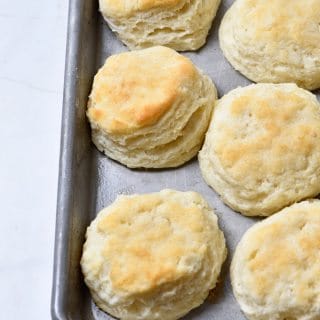 Make Ahead Biscuits Recipe - Make and bake biscuits ahead of time for quick and easy mornings! In less than 30 minutes, you'll have a week's worth of breakfast ready to grab, reheat and go! // addapinch.com