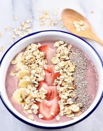 Strawberry Banana Smoothie Bowl Recipe - This strawberry banana smoothie bowl makes a flavorful and delicious fruit, nut, and oat smoothie bowl! Great for breakfast or an afternoon treat! // addapinch.com