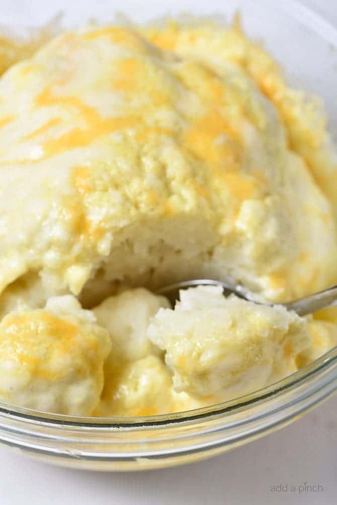 Easy Cheesy Cauliflower Recipe - This easy cauliflower recipe is perfect for weeknight suppers or Sunday dinners! It is a definite favorite the whole family loves! // addapinch.com