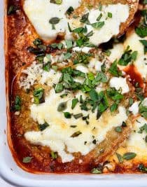 Eggplant Parmesan Recipe - Eggplant Parmesan makes a delicious and family favorite meal. This no-fry eggplant parmesan recipe is layered with baked eggplant, tomato sauce and cheese for a meatless meal the whole family loves! // addapinch.com