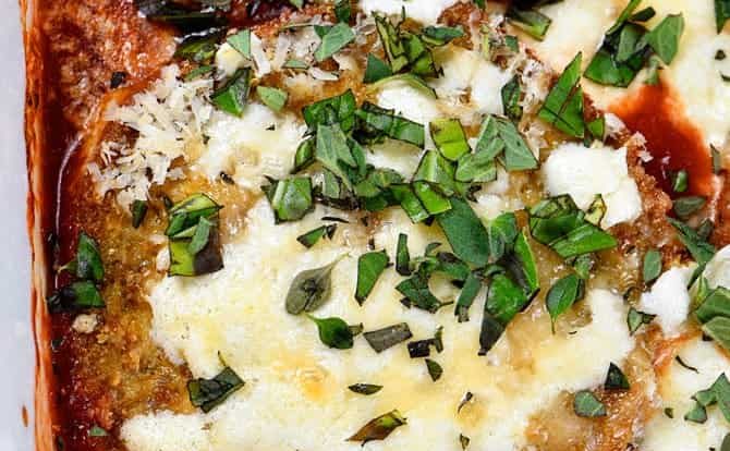 Eggplant Parmesan Recipe - Eggplant Parmesan makes a delicious and family favorite meal. This no-fry eggplant parmesan recipe is layered with baked eggplant, tomato sauce and cheese for a meatless meal the whole family loves! // addapinch.com
