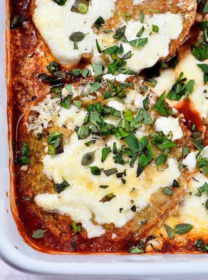 Eggplant Parmesan Recipe - Eggplant Parmesan makes a delicious and family favorite meal. This no-fry eggplant parmesan recipe is layered with baked eggplant, tomato sauce and cheese for a meatless meal the whole family loves! // addapinch.com