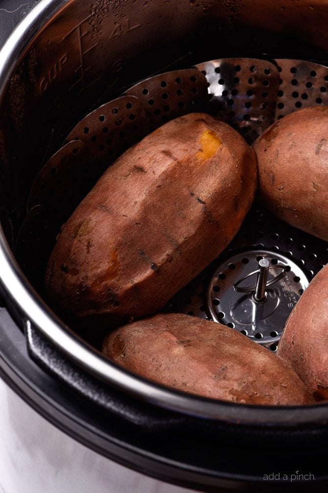 Instant Pot Sweet Potatoes Recipe - Cooking sweet potatoes in an Instant Pot or other electric pressure cooker makes cooking sweet potatoes so quick and easy! Perfect for enjoying as baked sweet potatoes as a side dish or for cooking to use in sweet potato casserole and so many other dishes! // addapinch.com