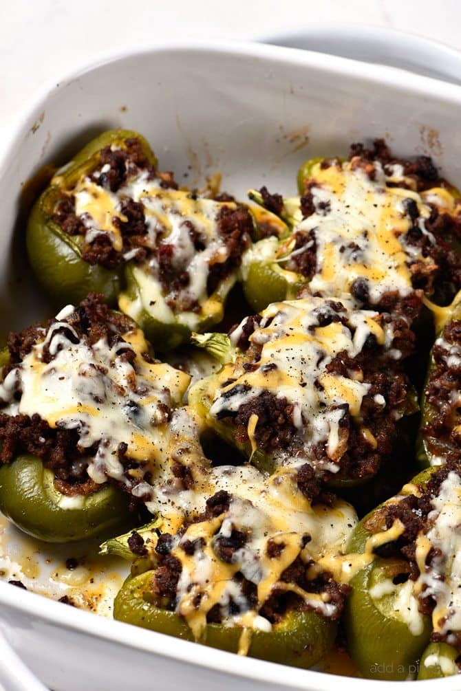 Chili Stuffed Peppers Recipe - Chili Stuffed Peppers make an easy and delicious meal! This recipe includes great make-ahead and freezer-friendly tips to make this dish even easier for busy weeknights! // addapinch.com