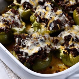 Chili Stuffed Peppers Recipe - These Chili Stuffed Peppers make a delicious meal perfect for busy weeknights or lazy weekends! // addapinch.com