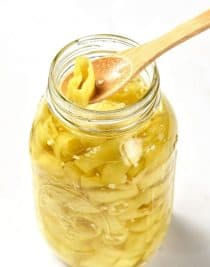 Easy Pickled Peppers Recipe - These Pickled Peppers make a quick and easy way to preserve your banana, jalapeno and other kinds of peppers! Perfect for using throughout the year in dishes like pizzas, soups, salads, sandwiches and so many more! // addapinch.com