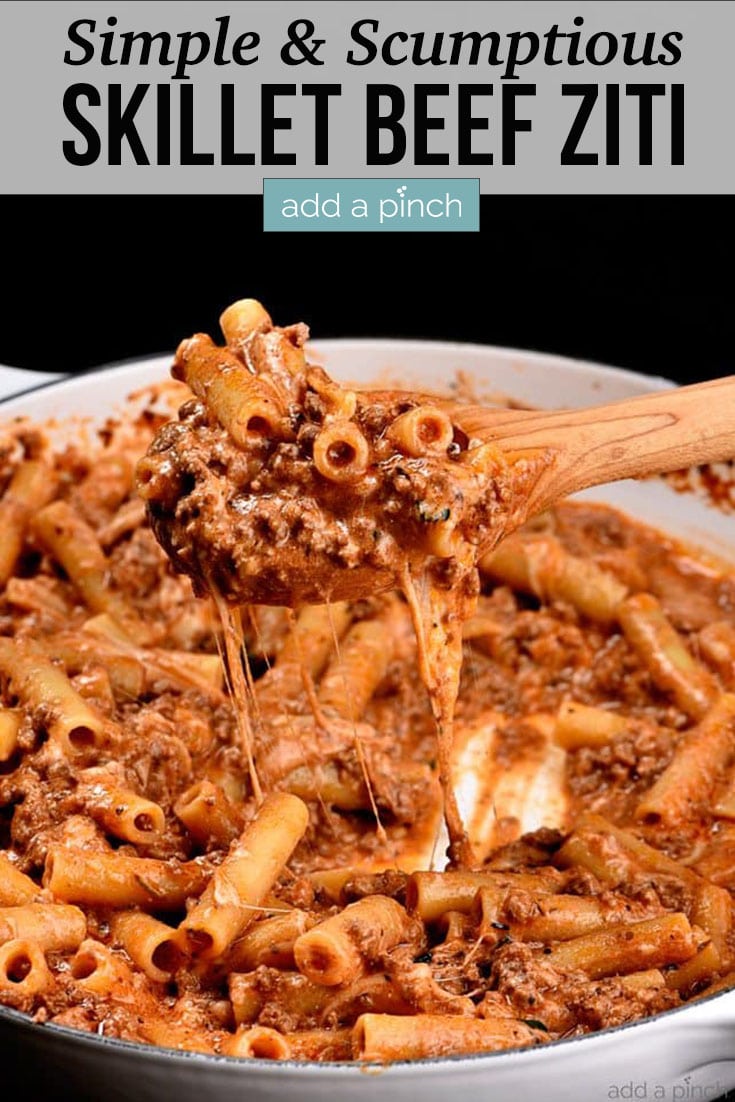 Skillet Beef Ziti begin lifted with wooden spoon and cheese pull - with text - addapinch.com