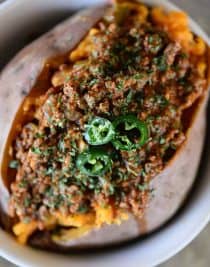 Chili Stuffed Sweet Potatoes Recipe - Chili Stuffed Sweet Potatoes makes a quick and easy meal! Ready and on the table in 30 minutes or a great make-ahead meal for even easier weeknights! // addapinch.com