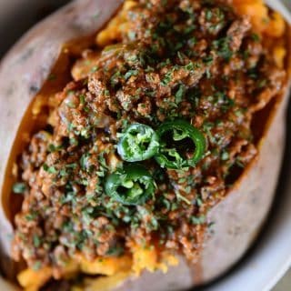 Chili Stuffed Sweet Potatoes Recipe - Chili Stuffed Sweet Potatoes makes a quick and easy meal! Ready and on the table in 30 minutes or a great make-ahead meal for even easier weeknights! // addapinch.com