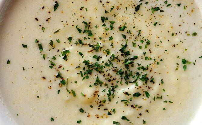 Creamy Cauliflower Soup Recipe - Creamy Cauliflower Soup makes a delicious and comforting soup recipe without a drop of cream! The garlic, onion, and cauliflower are blended together to create a dairy-free, creamy cauliflower soup recipe that everyone loves! // addapinch.com