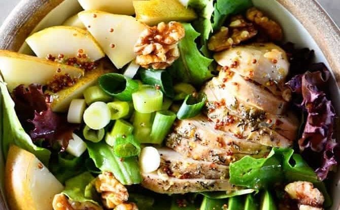 Fall Chicken Avocado Pear Salad Recipe - This salad makes for a delicious fall salad recipe! Filled with chicken, avocado, pears, walnuts, and topped with a Honey Mustard Dressing! // addapinch.com