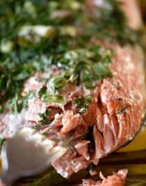 Herb Crusted Salmon in Foil Recipe - A quick and easy baked salmon recipe perfect for a busy weeknight or serving when company comes! A one pan meal that everyone loves made of asparagus, lemon, salmon, topped with an herb crust and baked until tender and delicious! // addapinch.com