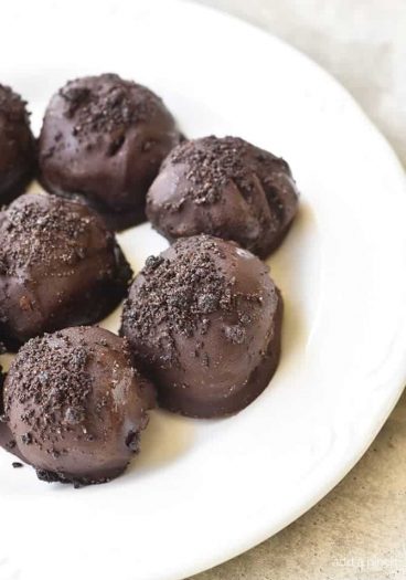 No Bake Oreo Truffles Recipe - These No Bake Oreo Truffles use just four ingredients and come together in a snap! Perfect to make throughout the year, but especially during the holidays! // addapinch.com