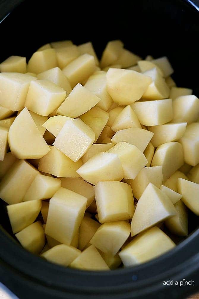 Slow Cooker Garlic Mashed Potatoes Recipe - This Slow Cooker Garlic Mashed Potatoes recipe makes an easy way to make a favorite side dish by letting the slow cooker do all the hard work! // addapinch.com