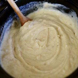 Slow Cooker Garlic Mashed Potatoes Recipe - This Slow Cooker Garlic Mashed Potatoes recipe makes an easy way to make a favorite side dish by letting the slow cooker do all the hard work! // addapinch.com