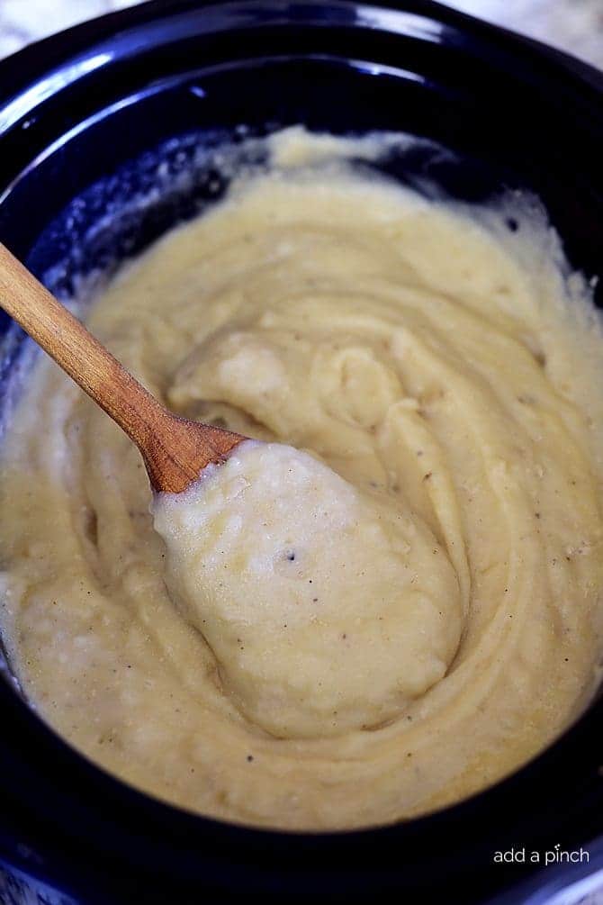 Slow Cooker Garlic Mashed Potatoes Recipe - This Slow Cooker Garlic Mashed Potatoes recipe makes an easy way to make a favorite side dish by letting the slow cooker do all the hard work! // addapinch.com