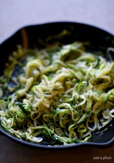 Olive Oil Garlic Zucchini Noodles Recipe - These Olive Oil Garlic Zucchini Noodles are fast and fabulous for a quick and easy way to incorporate more vegetables into your meals! Made with just a handful of ingredients and ready in minutes! // addapinch.com