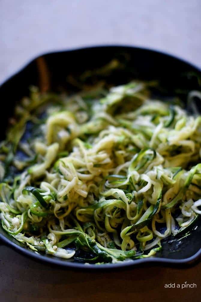 Olive Oil Garlic Zucchini Noodles Recipe - These Olive Oil Garlic Zucchini Noodles are fast and fabulous for a quick and easy way to incorporate more vegetables into your meals! Made with just a handful of ingredients and ready in minutes! // addapinch.com