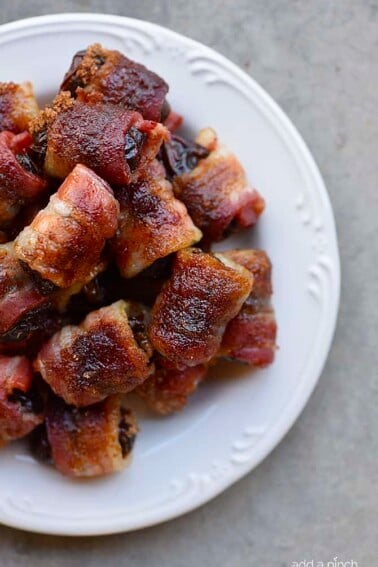 Bacon Wrapped Dates Recipe - These 5-ingredient bacon wrapped dates are out of this world delicious and so easy! // addapinch.com