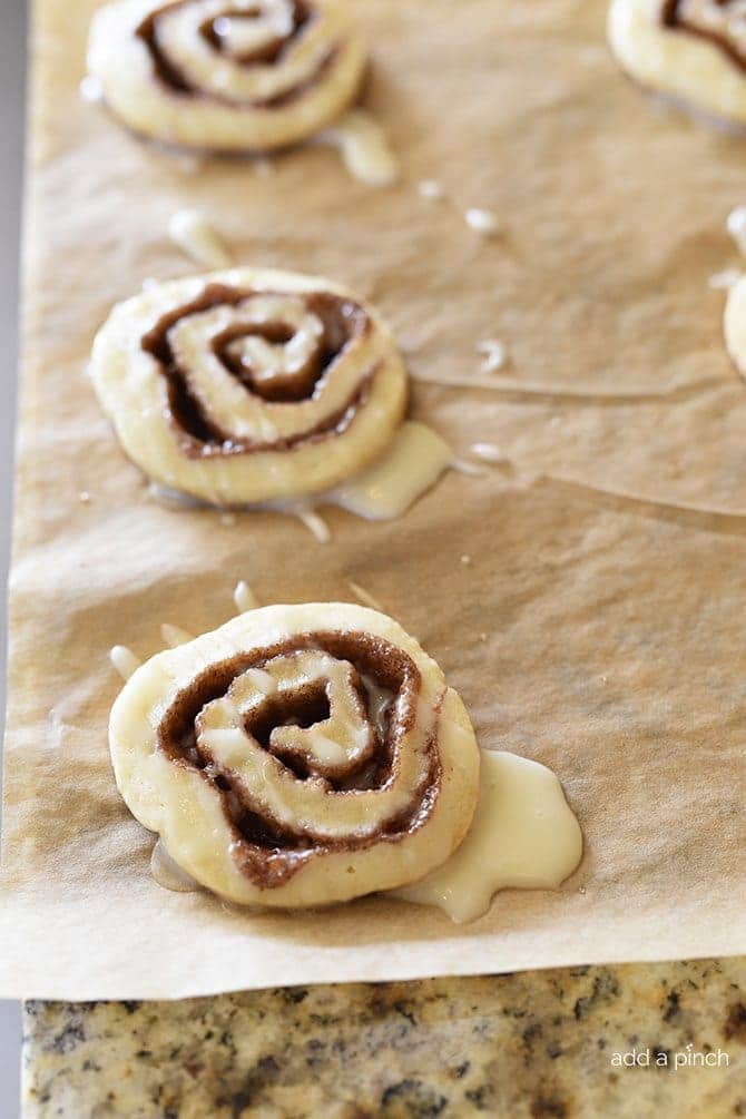 These Cinnamon Honey Bun Cookies make a delicious cookie perfect for your holiday cookie platter! // addapinch.com