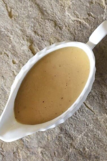 Make-Ahead Turkey Gravy Recipe - This easy turkey gravy recipe is essential to your holiday menu! Simple enough to make on the holiday, but perfect as a make ahead gravy recipe! // addapinch.com