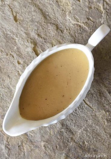Make-Ahead Turkey Gravy Recipe - This easy turkey gravy recipe is essential to your holiday menu! Simple enough to make on the holiday, but perfect as a make ahead gravy recipe! // addapinch.com
