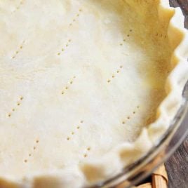 A pie crust recipe that works perfectly for sweet and savory pies. This pie crust recipe is made by hand and makes a perfect pie crust every single time! // addapinch.com