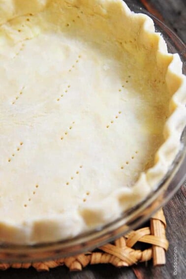 A pie crust recipe that works perfectly for sweet and savory pies. This pie crust recipe is made by hand and makes a perfect pie crust every single time! // addapinch.com