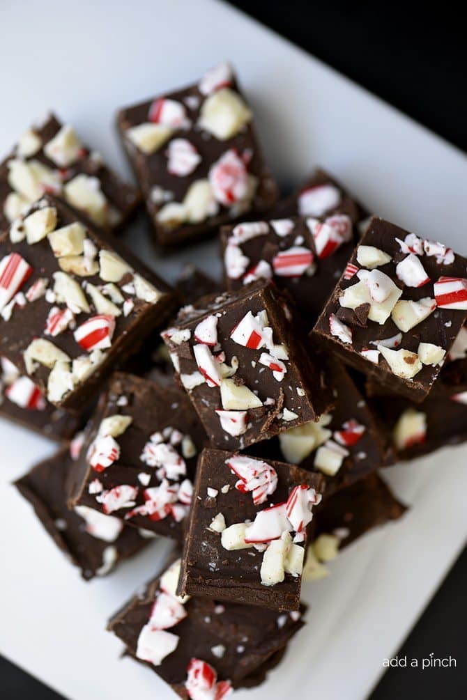 Peppermint Fudge Recipe - Peppermint Fudge makes a holiday favorite fudge recipe! A mint and chocolate lovers' dream! // addapinch.com