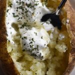 Perfect Baked Potato Recipe - The perfect baked potato recipe for a crispy, golden skin and a fluffy, tender inside. Learn how to make the best baked potatoes every time! // addapinch.com