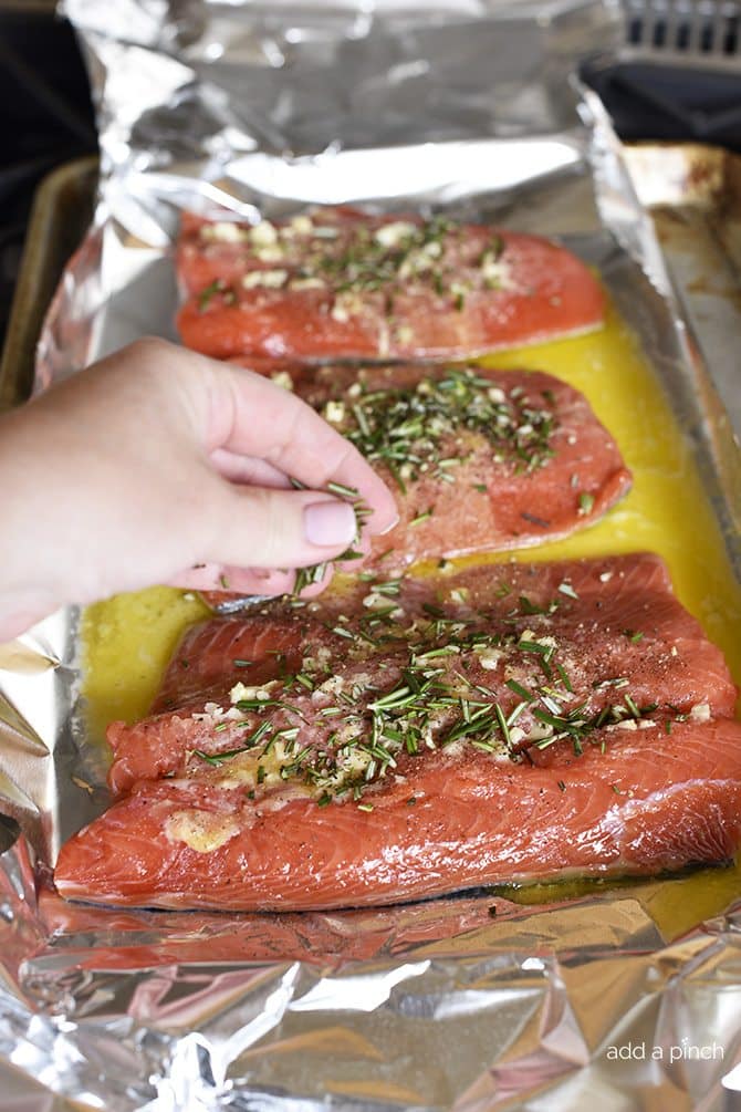 Lemon Garlic Butter Salmon Recipe - This Lemon Garlic Butter Salmon recipe makes a quick and easy recipe! Baked in a foil packet for incredibly tender salmon with easy cleanup! // addapinch.com