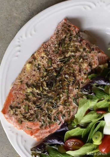 Lemon Garlic Butter Salmon Recipe - This Lemon Garlic Butter Salmon recipe makes a quick and easy recipe! Baked in a foil packet for incredibly tender salmon with easy cleanup! // addapinch.com