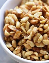 Honey Roasted Peanuts Recipe - Honey Roasted Peanuts make a delicious snack! Made with just four ingredients with one addition if you prefer them spicy! // addapinch.com