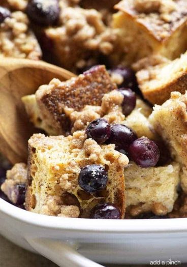 Baked Blueberry French Toast Recipe - This Baked Blueberry French Toast makes a delicious breakfast or brunch recipe! Made with bread, blueberries, maple syrup and topped with a streusel topping, this is always a favorite! // addapinch.com