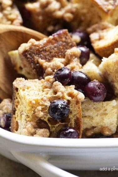 Baked Blueberry French Toast Recipe - This Baked Blueberry French Toast makes a delicious breakfast or brunch recipe! Made with bread, blueberries, maple syrup and topped with a streusel topping, this is always a favorite! // addapinch.com