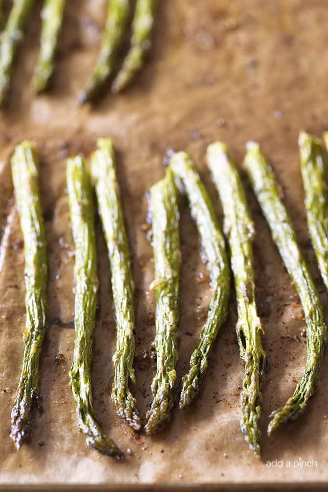 Garlic Butter Roasted Asparagus Recipe - Garlic Butter Roasted Asparagus makes a quick and easy, delicious side dish! // addapinch.com