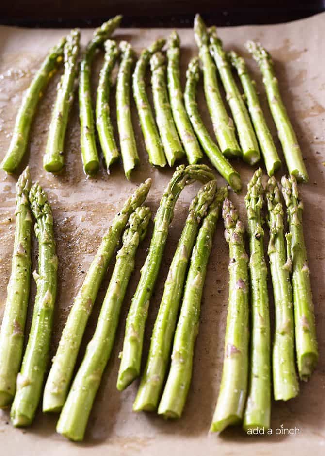 Garlic Butter Roasted Asparagus Recipe - Garlic Butter Roasted Asparagus makes a quick and easy, delicious side dish! // addapinch.com