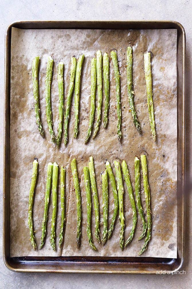 Garlic Butter Roasted Asparagus Recipe - Garlic Butter Roasted Asparagus makes a quick and easy, delicious side dish! // addapinch.com