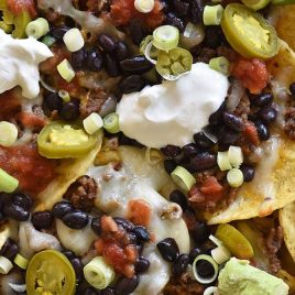 Sheet Pan Nachos Recipe - Sheet Pan Nachos make a quick and easy appetizer for a crowd or easy weeknight supper! These nachos are always a favorite! // addapinch.com