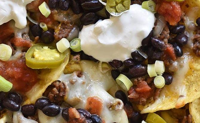 Sheet Pan Nachos Recipe - Sheet Pan Nachos make a quick and easy appetizer for a crowd or easy weeknight supper! These nachos are always a favorite! // addapinch.com