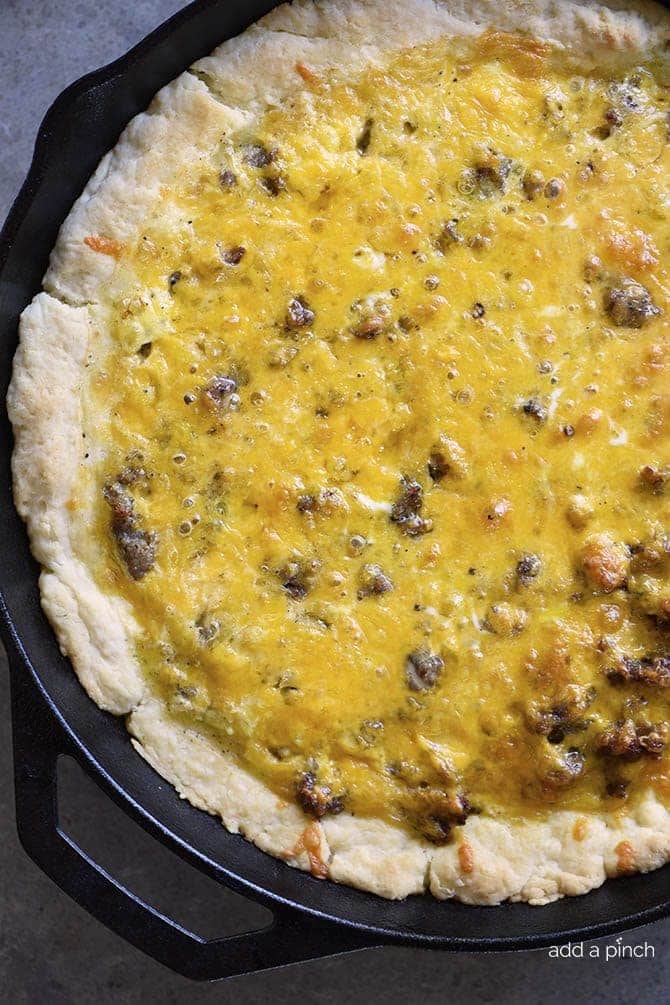 Southern Sausage Cheddar Quiche in iron skillet // addapinch.com