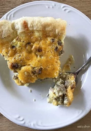 Southern Sausage Cheddar Quiche Recipe - This Southern Sausage Cheddar Quiche recipe makes a quick and easy breakfast recipe. Ready and on the table in 30 minutes, it is a Southern update to a classic! // addapinch.com