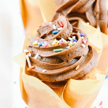 An easy recipe for vanilla cupcakes topped with a delicious chocolate buttercream frosting. They make the perfect cupcakes for every occasion! // addapinch.com