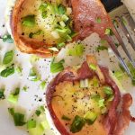 Bacon Egg Cups on a white plate.