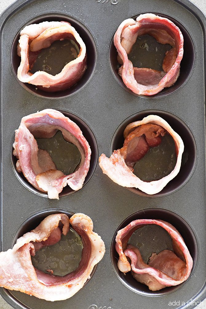 Bacon Egg Cups Recipe - Bacon Egg Cups make a delicious recipe perfect for serving for breakfast, brunch or snack! Great to make for a crowd or to make ahead and reheat for busy mornings! // addapinch.com