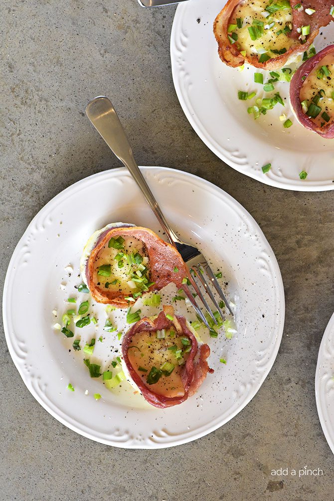 Bacon Egg Cups Recipe - Bacon Egg Cups make a delicious recipe perfect for serving for breakfast, brunch or snack! Great to make for a crowd or to make ahead and reheat for busy mornings! // addapinch.com