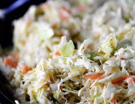 Coleslaw Recipe - A classic coleslaw recipe. Made of cabbage and topped with a delicious dressing, this coleslaw recipe is one you'll use again and again! // addapinch.com