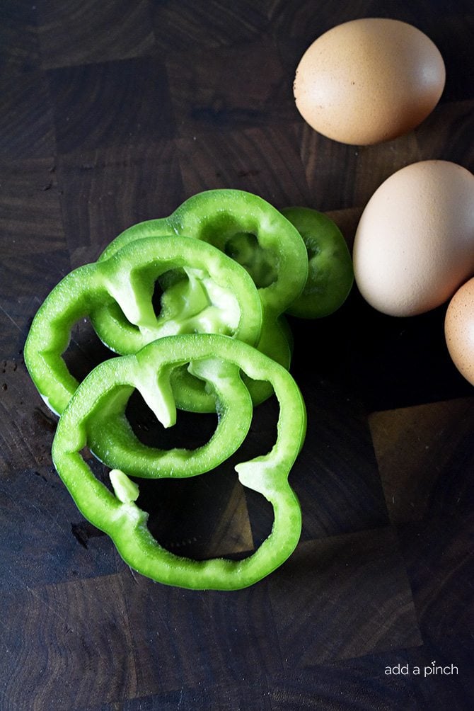 Eggs in Pepper Rings Recipe - These Eggs in Pepper Rings make a quick, easy and delicious recipe for breakfast or brunch! With just a few ingredients, you'll have a fast, fresh, and fabulous meal! // addapinch.com