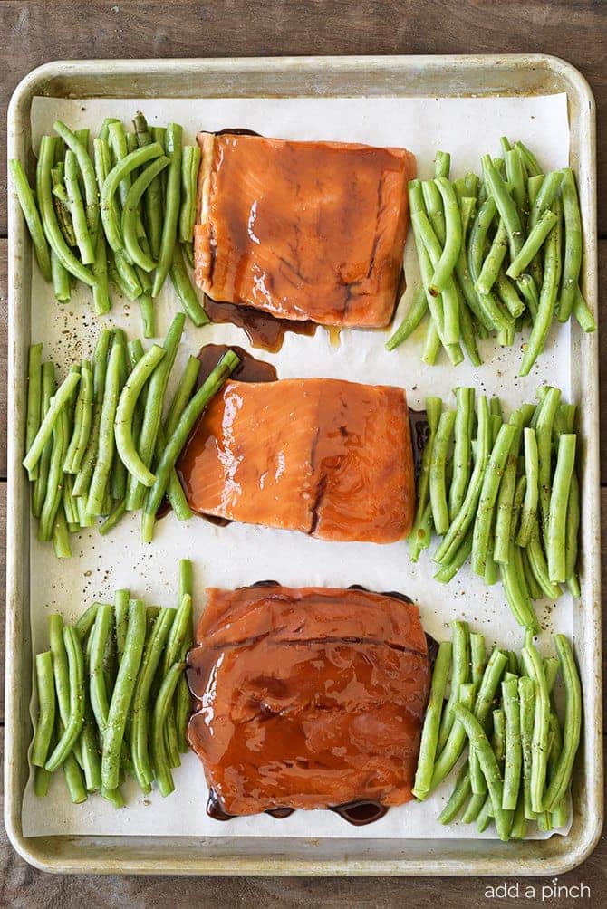 Sheet Pan Teriyaki Salmon with Green Beans Recipe - This Sheet Pan Teriyaki Salmon with Green Beans recipe comes together in a snap! Ready and on the table in less than 30 minutes, it is a definite family favorite meal! // addapinch.com